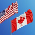 An image of the Canadian and American flags flying against a blue background.